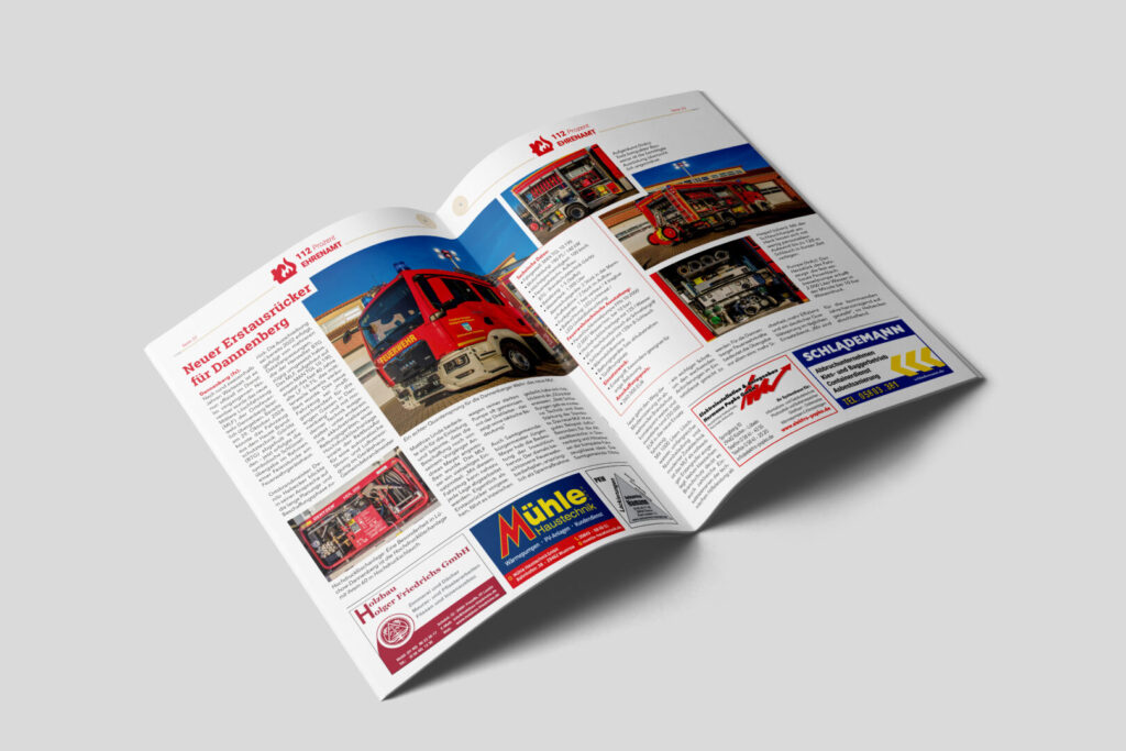 Aufgeschlagene Doppelseite des Feuerwehrmagazins „112 Prozent Ehrenamt“ mit Artikeln und Anzeigen